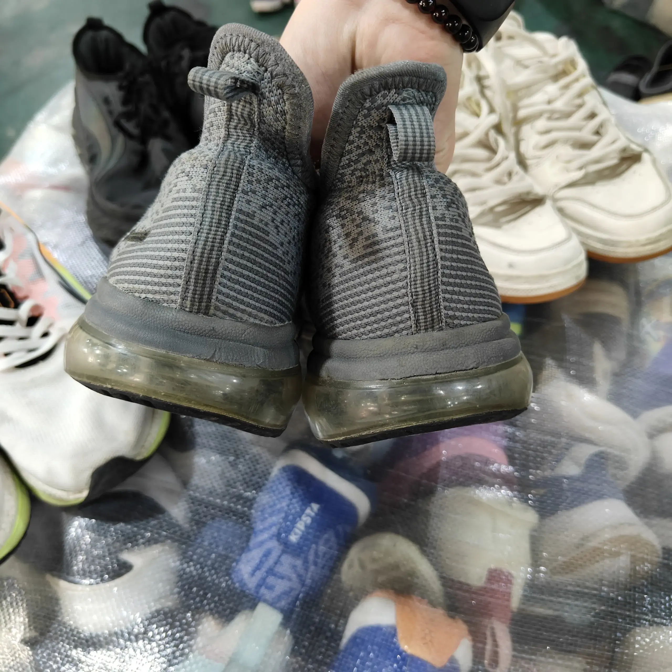 Grey mesh sneakers with clear sole, wholesale used shoes from RossBoss, factory-direct supplier.