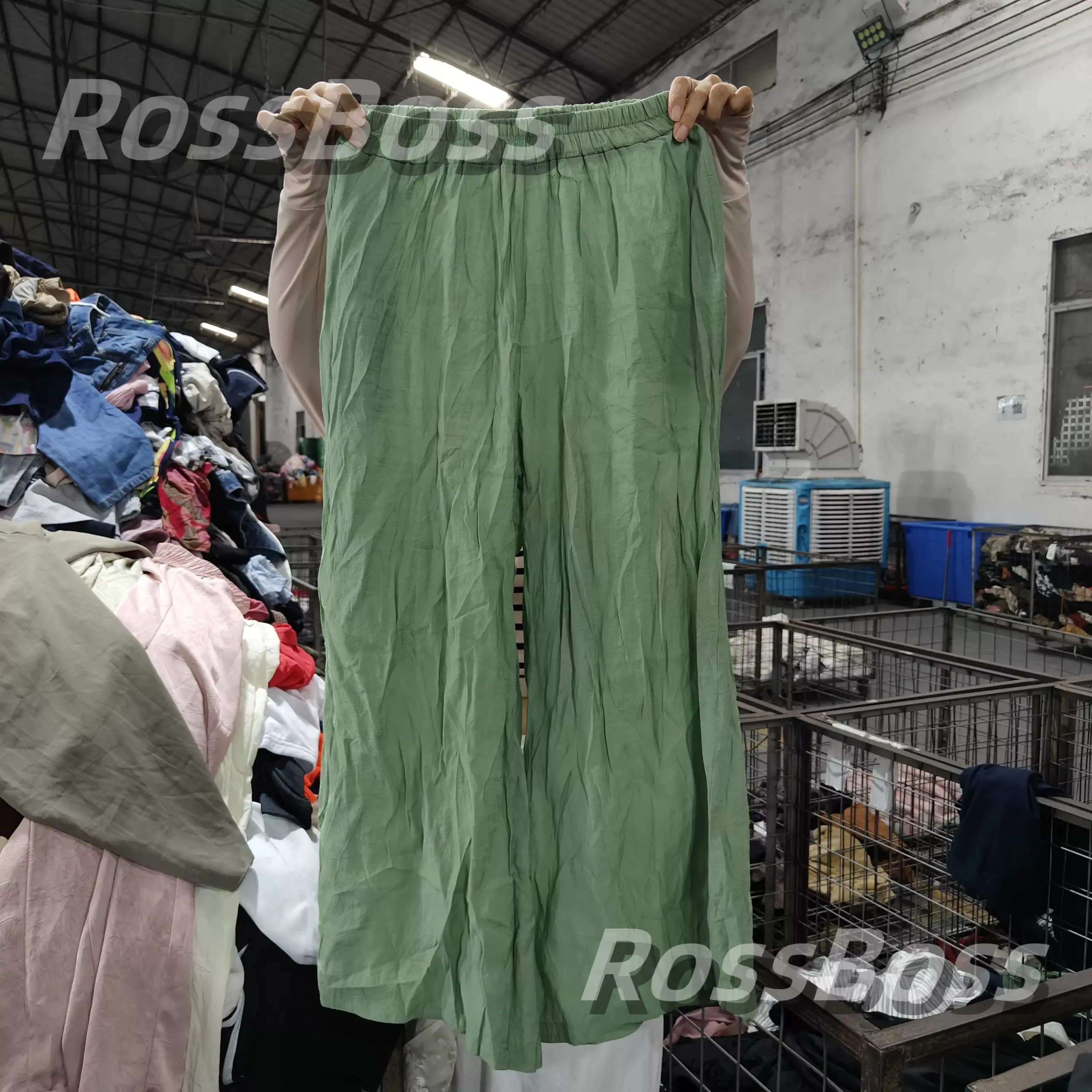 Green women's pants from RossBoss, available in various colors and sizes, perfect for your wholesale needs.