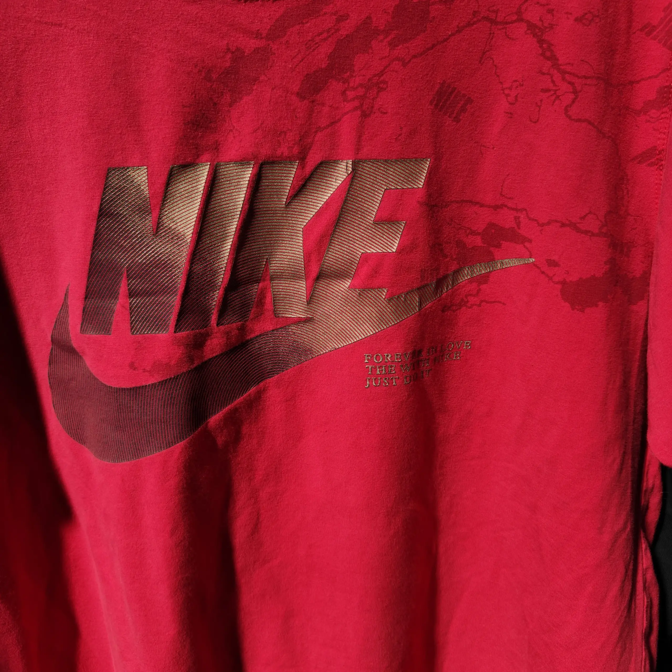 Nike red t-shirt with gold logo and text
