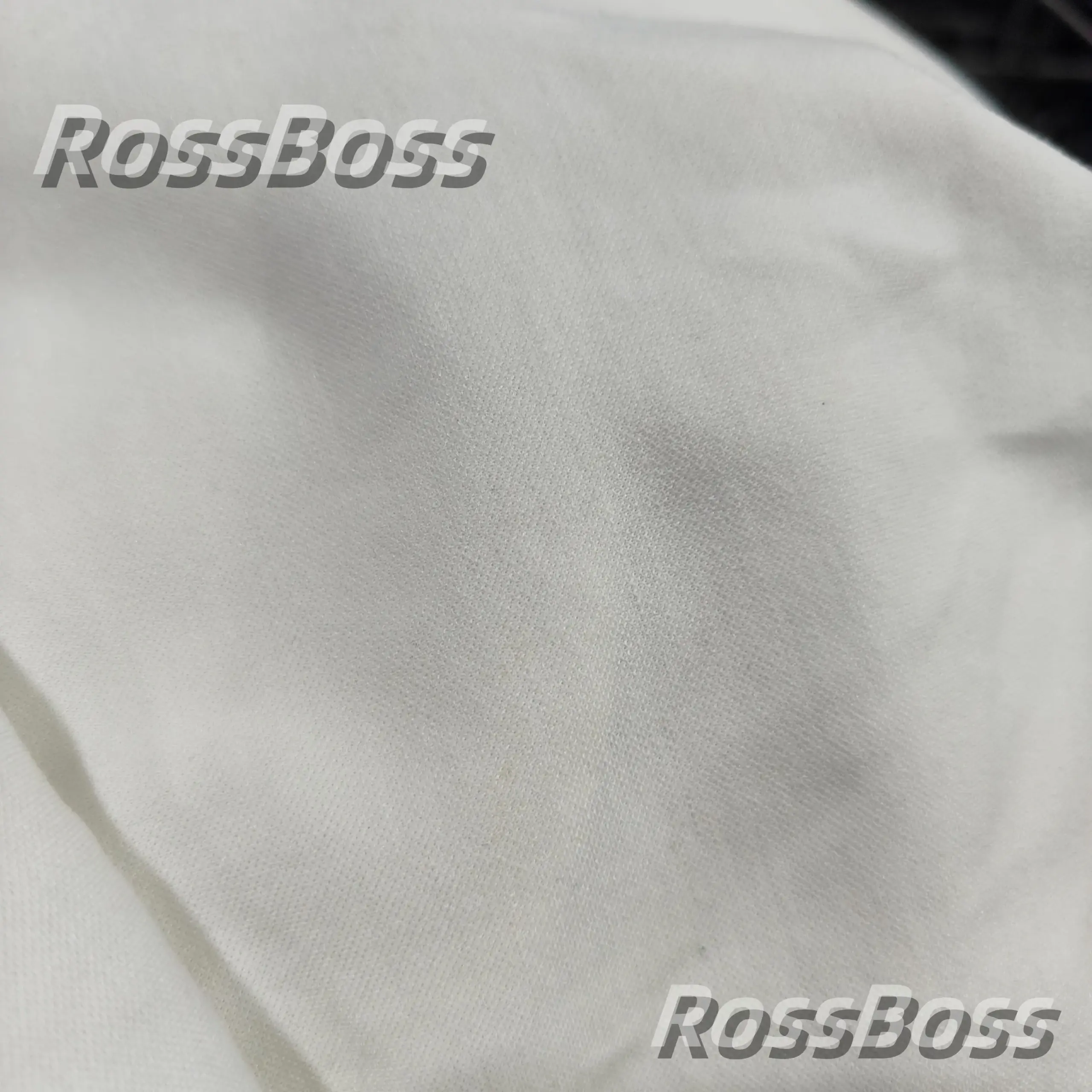 White cotton fabric with a subtle texture pattern.