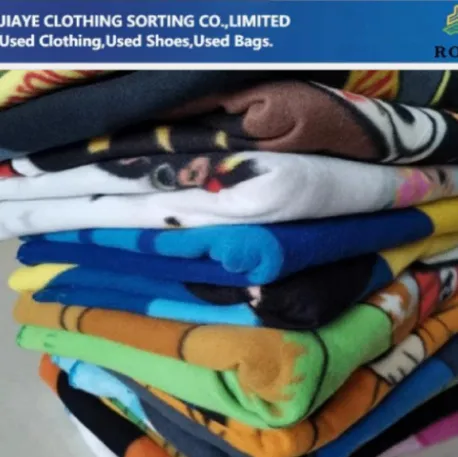 Used Clothing Bales from RossBoss, featuring a variety of colors and cartoon prints, available for wholesale purchase.