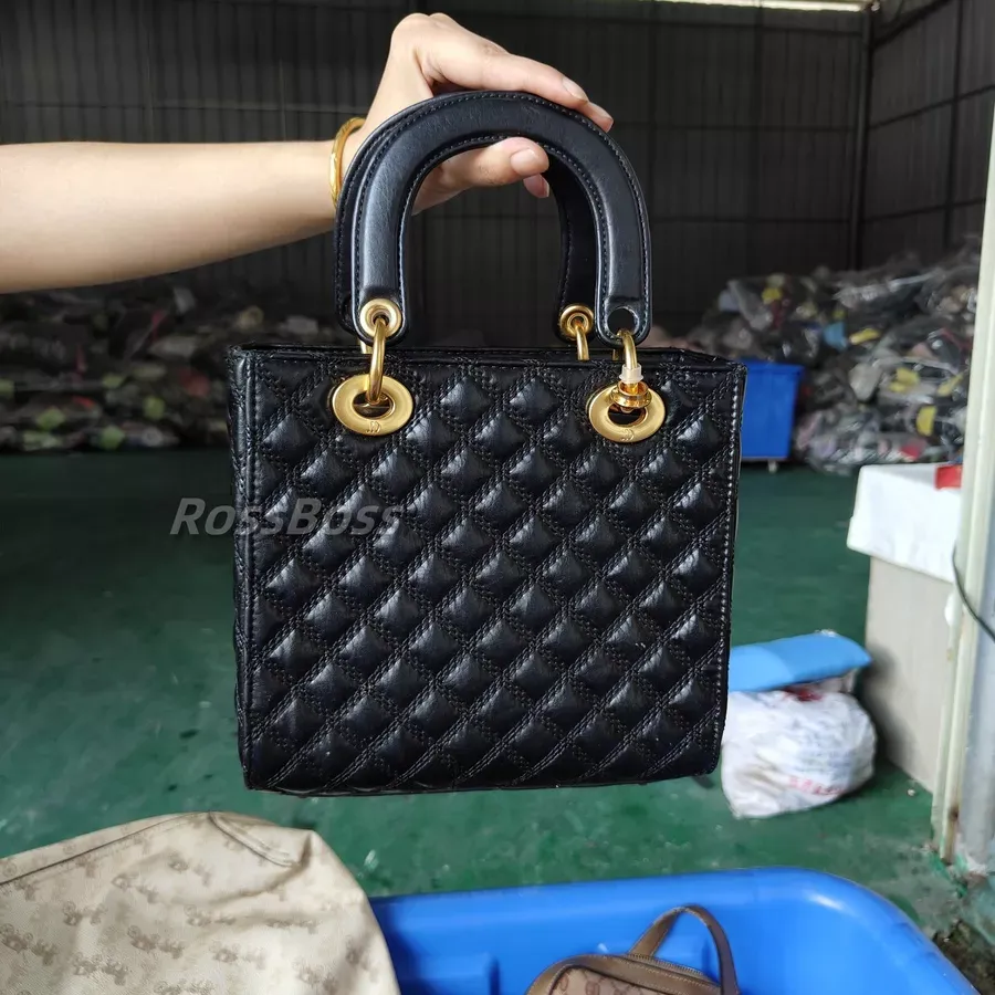 Quilted black leather handbag with gold-tone hardware, multiple colors available.