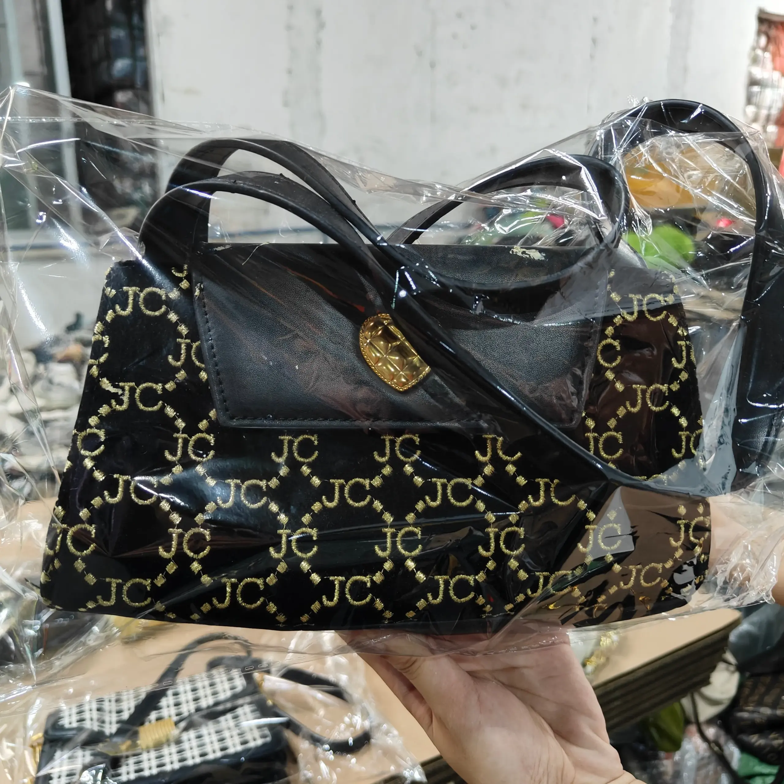 JC Logo Embossed Black Leather Bag with Gold Hardware