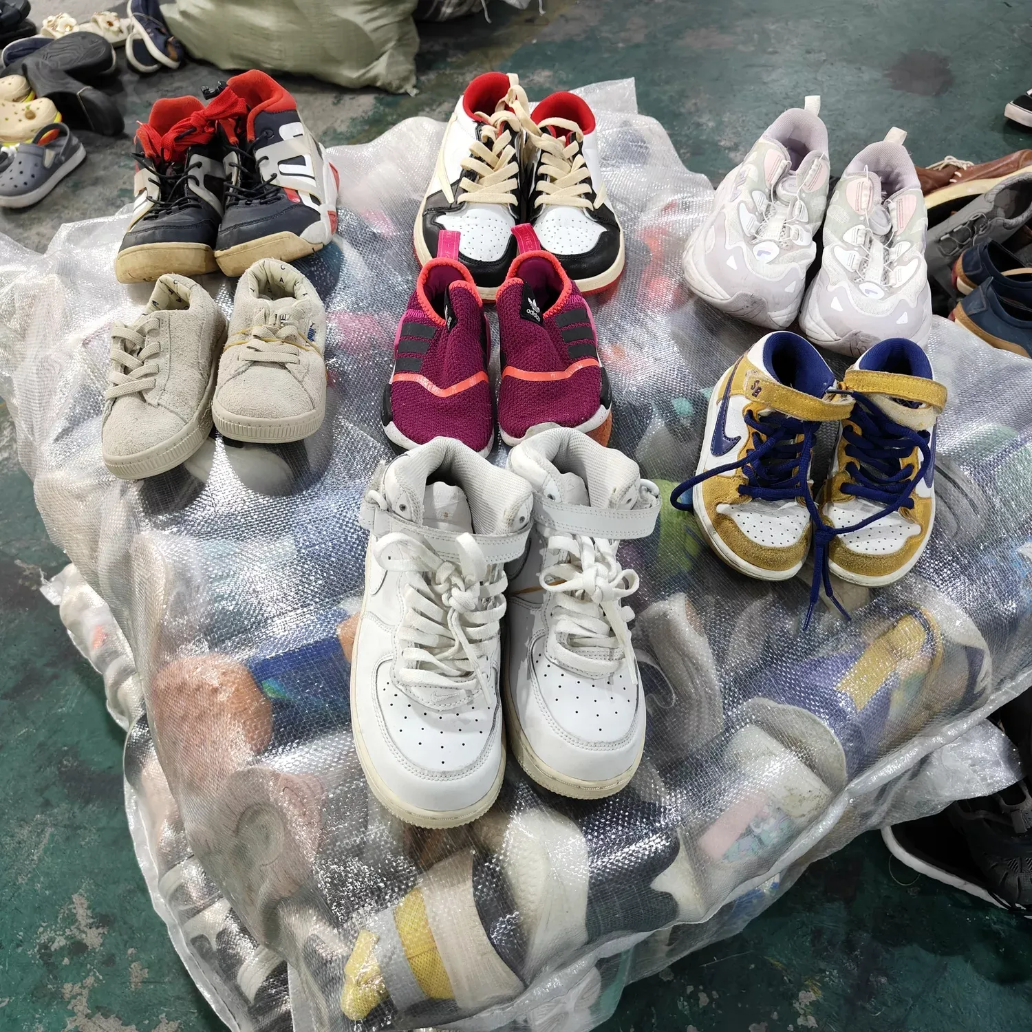 Children's shoes bales from RossBoss, featuring a variety of styles and colors, ready for wholesale distribution.