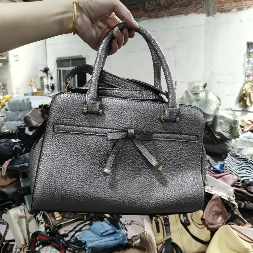 Silver leather handbag with bow detail